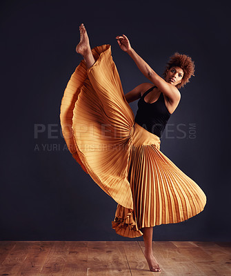 Buy stock photo Female contemporary dancer in a dramatic pose against dark background