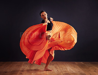 Buy stock photo Dancer, performance and woman in studio for creative, movement and rhythm on floor. African person isolated in dress for art deco and stretch body for theater, ballet or jazz on dark background 