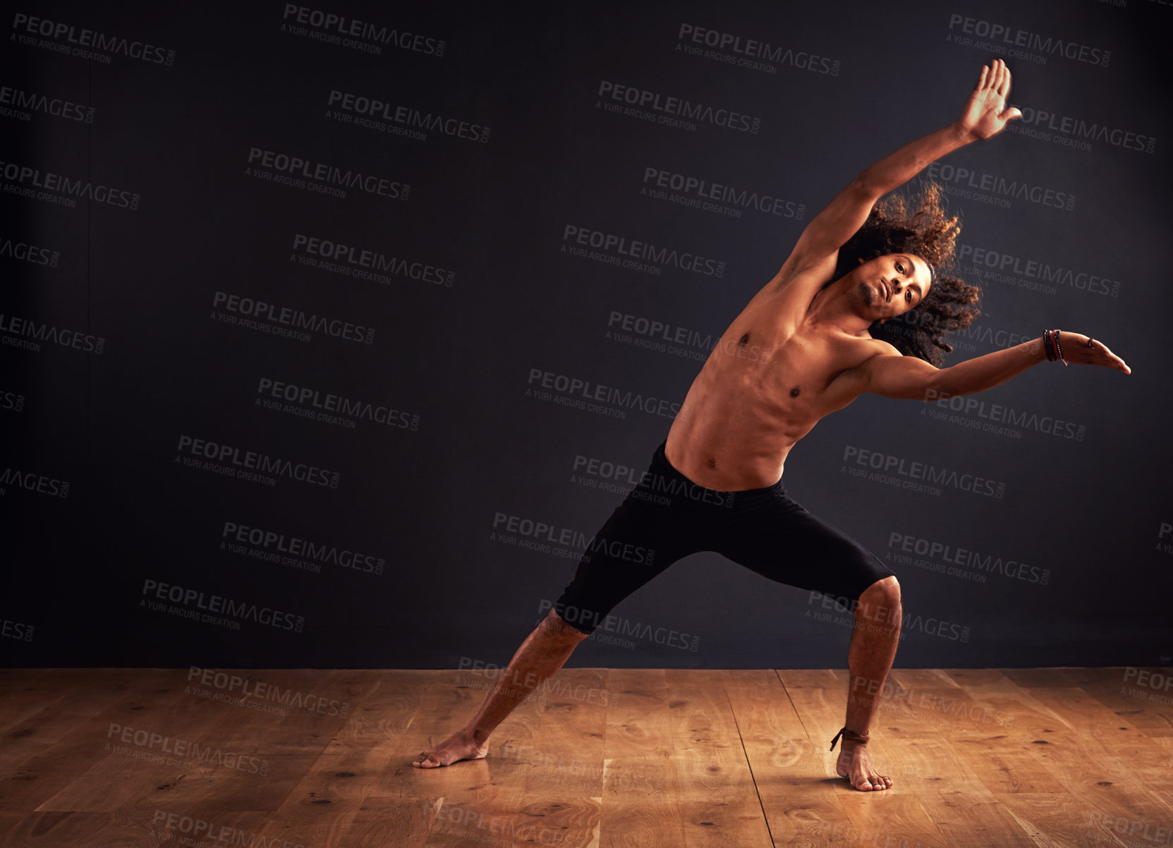 Buy stock photo Dancer, performance and man in studio for creative, movement and rhythm on floor. African male isolated and shirtless for art deco and stretch body for theater, ballet or jazz on dark background    