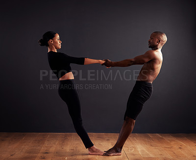 Buy stock photo Performance, theatre and duet of people dancing, creative and art of body, moving and passion. Black background, man and woman with pride, confident and ballet with balance in stage or floor