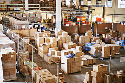 Buy stock photo Shot of the interior of a large packaging and distribution warehouse