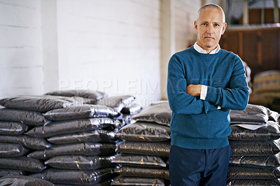 Buy stock photo Coffee, warehouse and portrait of man with bags for distribution, quality control and confident logistics. Export, manufacturing and proud entrepreneur with beans at factory for sustainable business