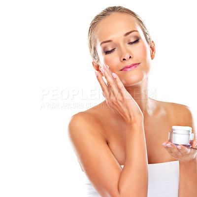 Buy stock photo Woman, moisturizer and skincare lotion in studio or health treatment as product, wellness or white background. Female person, finger and face cream or dermatology self care, mockup space or sunscreen