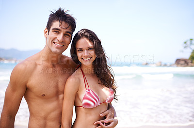 Buy stock photo Couple, beach and swimwear in portrait for hug with happiness, love or commitment for relationship. Man, woman and smile for relaxation, summer and sea on vacation, embrace and together in Costa Rica