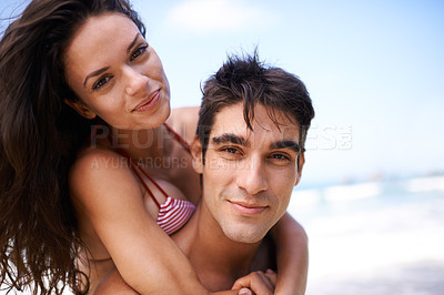 Buy stock photo Piggyback, travel and portrait of couple at beach on vacation, adventure or holiday for romance. Happy, love and young man and woman on date by ocean for tropical outdoor anniversary weekend trip.