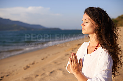 Buy stock photo Prayer hands, woman and meditation on beach with mindfulness, eyes closed and zen with fresh air for calm outdoor. Ocean, breeze and travel with yoga for health, peace of mind and holistic healing 