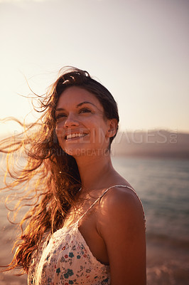 Buy stock photo Cropped shot of a beautiful young woman on the beach