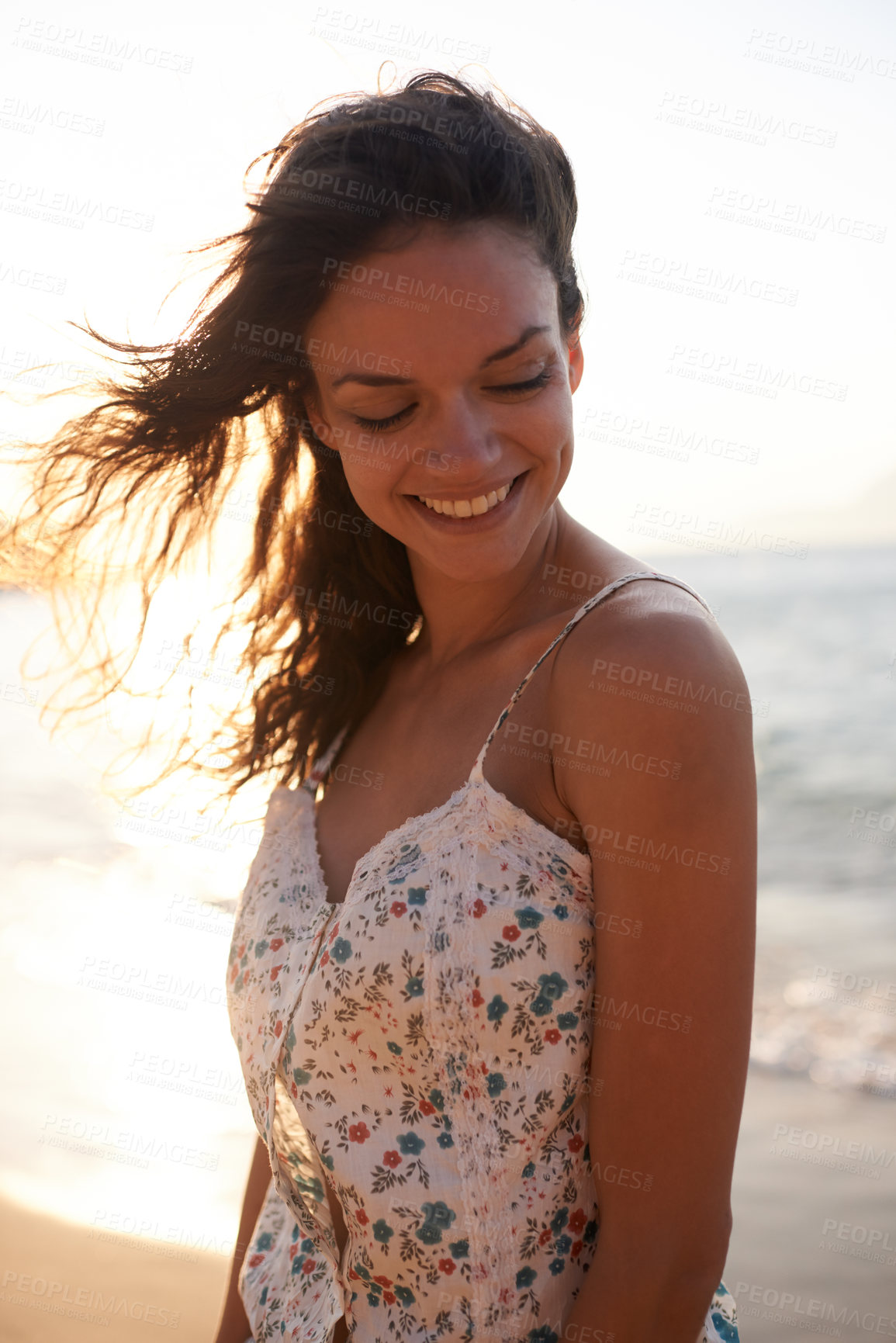 Buy stock photo Happy, beach and woman at sunset for holiday, summer vacation and weekend outdoors. Nature, travel and girl or person with smile for relaxing, adventure and wind by ocean on tropical island.