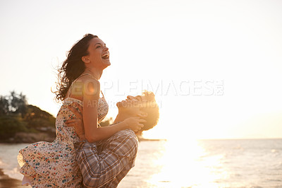 Buy stock photo Beach, sunset and man lifting woman with hug by ocean, happiness and freedom on vacation in Cancun for anniversary. Love, laughter and bonding with adventure together, commitment and trust outdoor