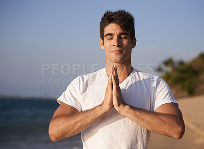 Buy stock photo Yoga, prayer and man at beach in meditation for zen peace, wellness and mindfulness in outdoor nature. Hands, pilates and calm male person on holiday vacation for spiritual healing or mental health