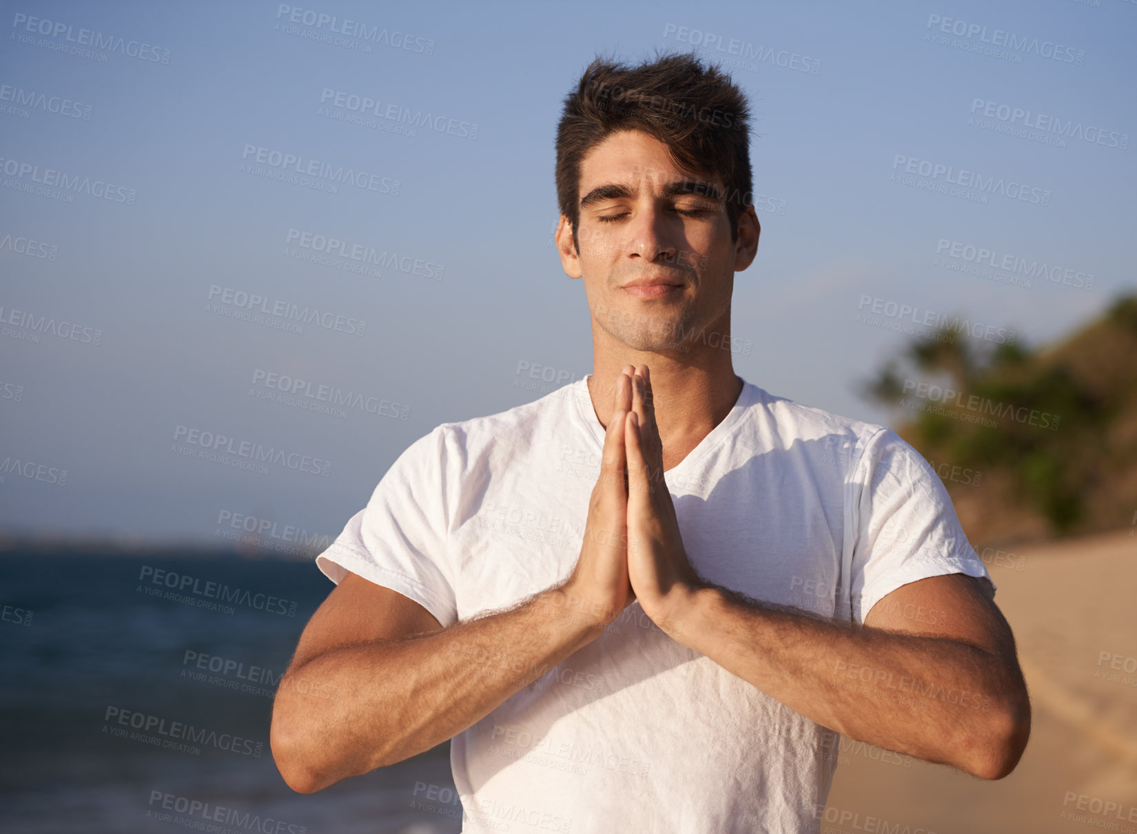 Buy stock photo Yoga, prayer and man at beach in meditation for zen peace, wellness and mindfulness in outdoor nature. Hands, pilates and calm male person on holiday vacation for spiritual healing or mental health