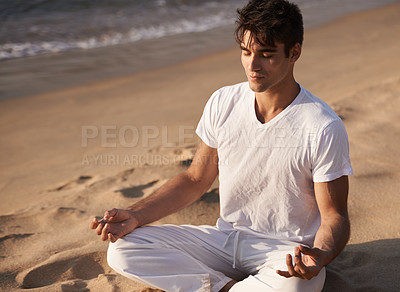 Buy stock photo Meditate, lotus and man on beach, mindfulness and zen with fresh air for calm and eyes closed outdoor. Ocean, seashore and travel with yoga for health, peace of mind and holistic healing for aura