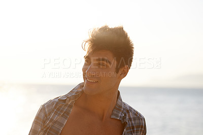 Buy stock photo Sunset, ocean and face of man on beach in summer for vacation, holiday and weekend outdoors. Nature, travel and happy person with smile for relaxing, adventure and freedom by sea on tropical island