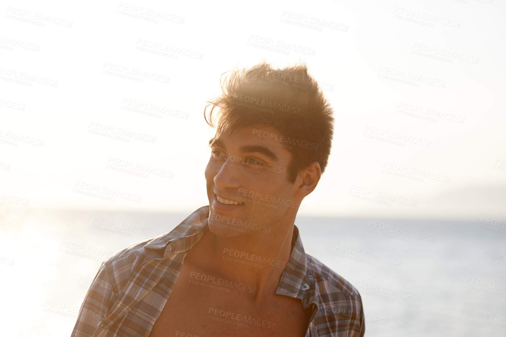 Buy stock photo Sunset, ocean and face of man on beach in summer for vacation, holiday and weekend outdoors. Nature, travel and happy person with smile for relaxing, adventure and freedom by sea on tropical island