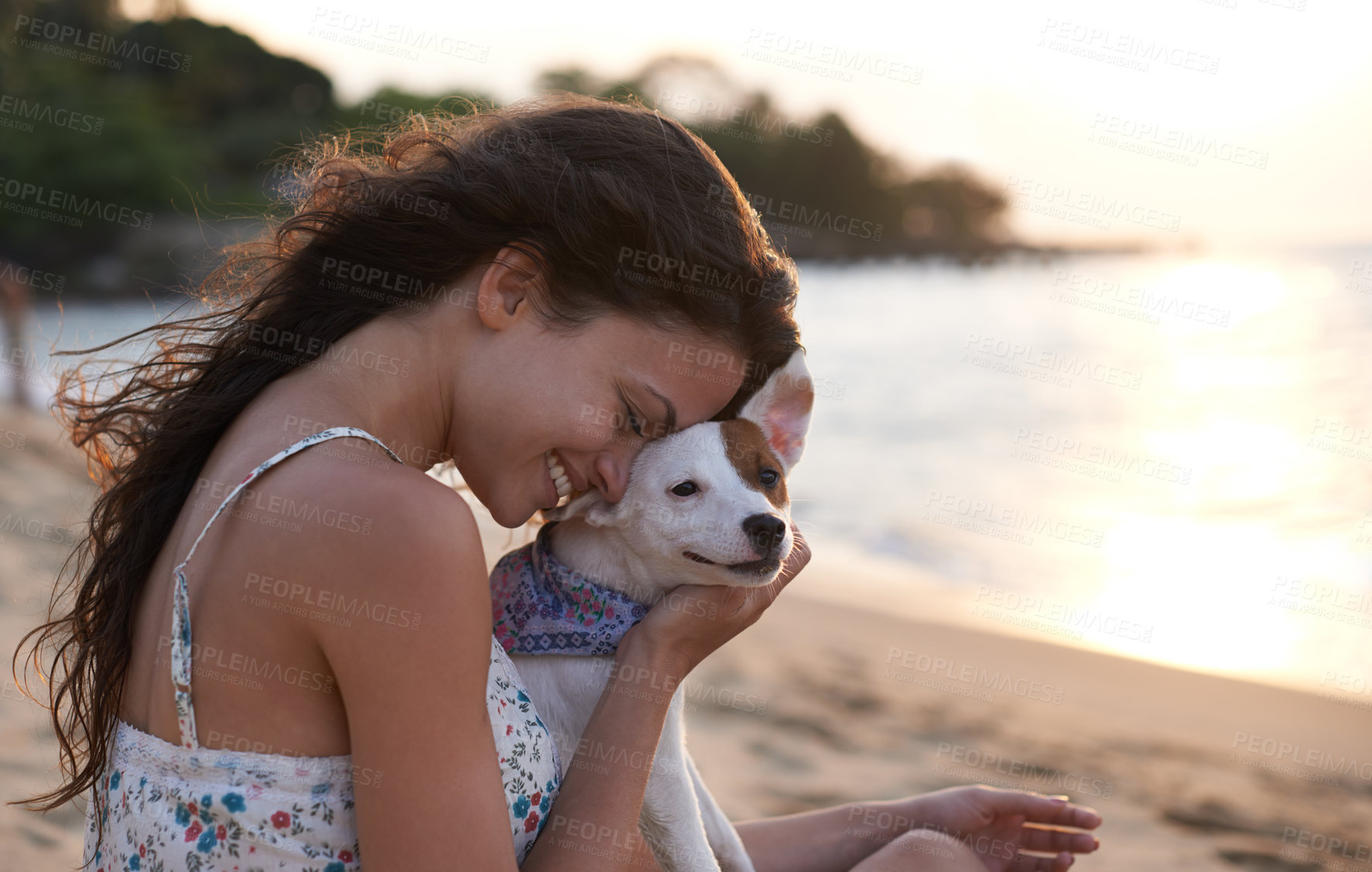 Buy stock photo Shot of an attractive young woman enjoying the beach with her dog