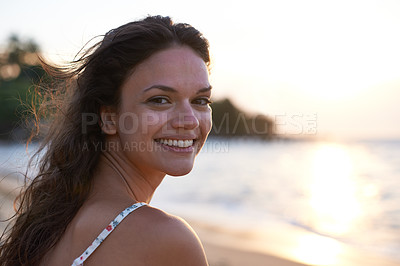 Buy stock photo Woman, sunset and beach with portrait, smile and happy for wellness, travel and journey on island. Female person, cheerful and nature for vacation, holiday and outdoor in coastal, tropical and summer