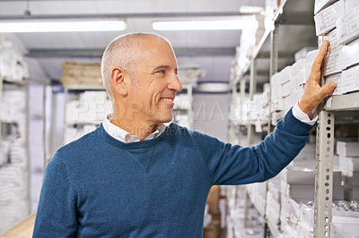 Buy stock photo Cargo, stock or senior business man in a warehouse for pricing, inventory or ecommerce box order. Logistics, online shopping or retail by male factory manager with shipping product, package or search