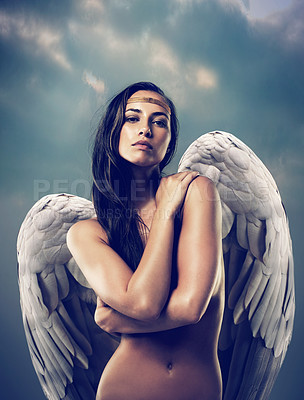Buy stock photo Shot of a female angel against the sky