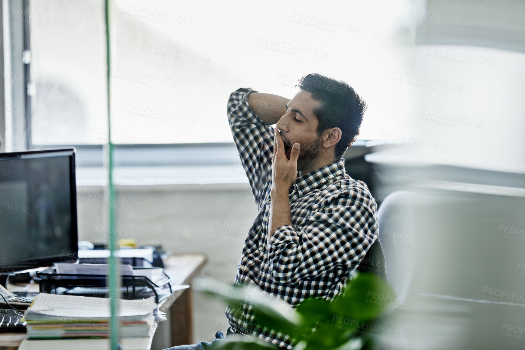 Buy stock photo Man, yawn and tired in office with computer or paperwork on file,  desk and exhausted as employee with deadline. Company, business and fatigue from administration work or overtime in pc and folder 