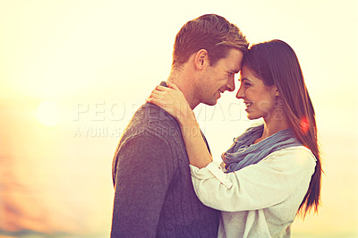 Buy stock photo Couple, hug and sunset at beach with smile for vacation, love and care in nature, outdoor and ocean. Man, woman and embrace with trust, bonding and happy for memory on holiday by sea in Australia