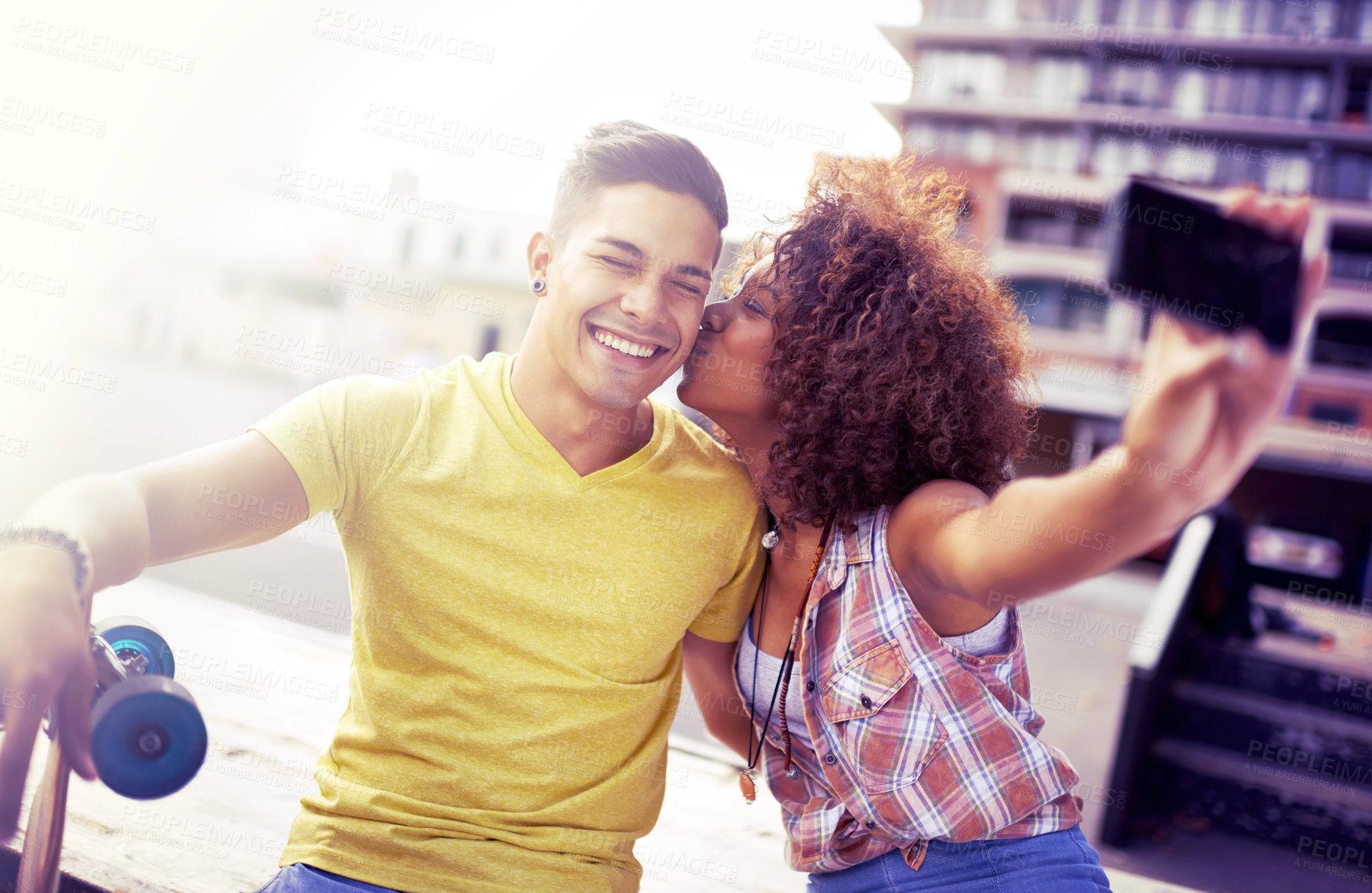 Buy stock photo Interracial couple, smile and selfie with smartphone in city for date, vacation and travel in outdoor. Cellphone, happy man and woman together for skateboarding in social media, memory or romance