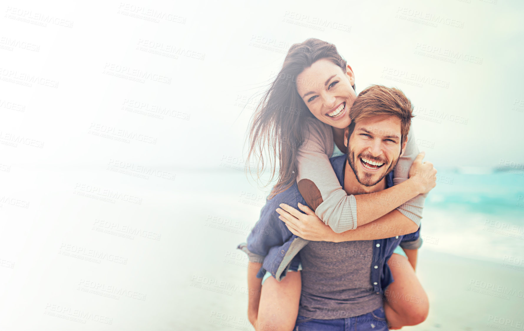Buy stock photo Couple on beach, portrait and piggyback with happiness, travel and holiday, love and care with trust. Freedom, mockup space and happy man with woman outdoor, summer holiday and hug by the ocean
