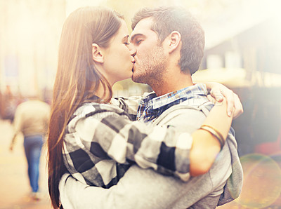 Buy stock photo Outdoor, kissing and couple with love, hug and marriage with anniversary, sunshine and relationship. New York, man and woman romance, dating and making out with peace, trust and bonding together