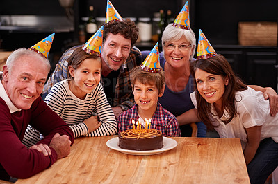 Buy stock photo Family, birthday and portrait with boy, parents and grandparents together with cake and candles. Happy, smile and dessert with children and celebration with event food and party hats at a table