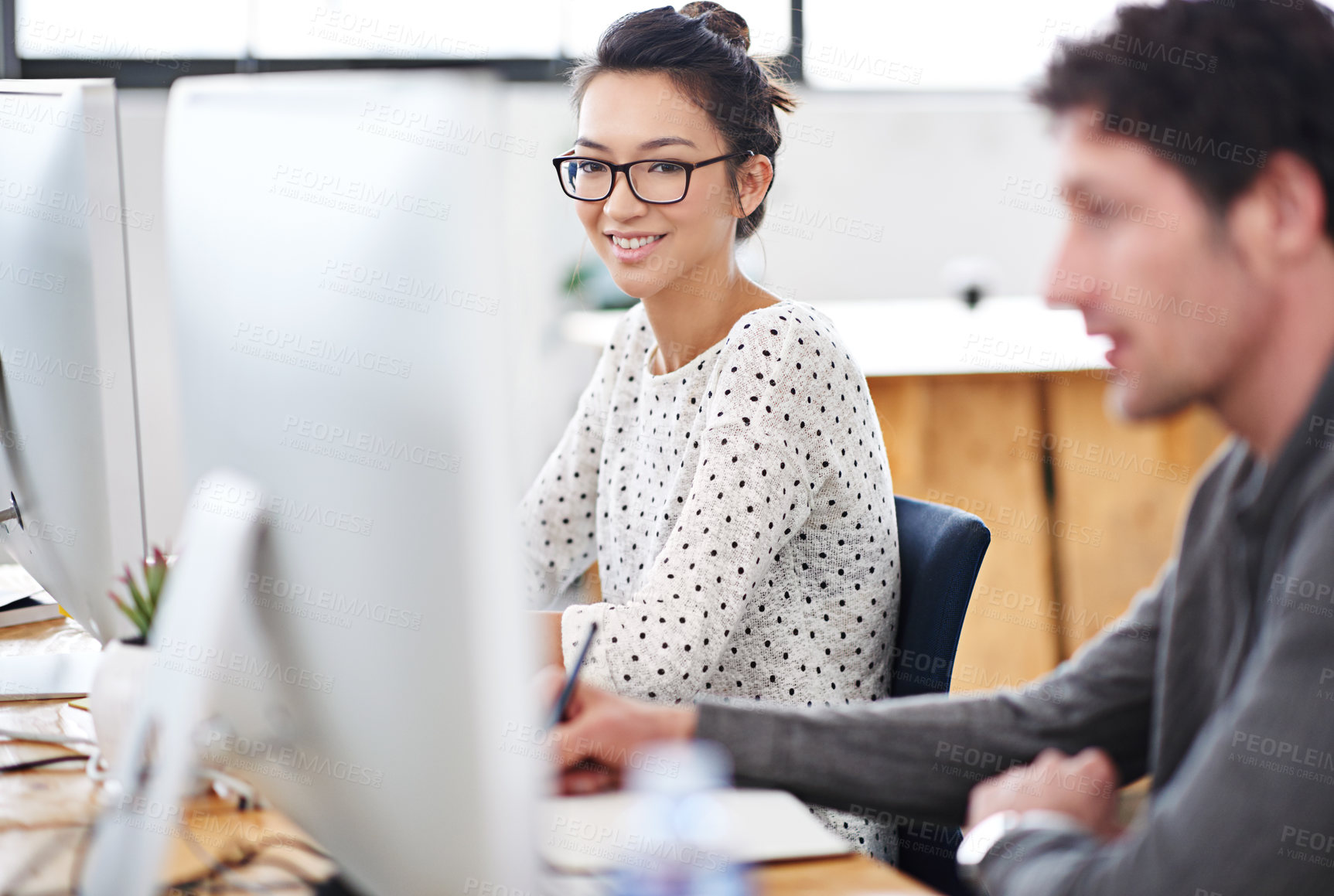 Buy stock photo Portrait, smile and business woman at computer in office of creative startup for coworking or career. Face, happy professional and entrepreneur on desktop, graphic designer or employee with glasses