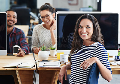 Buy stock photo Portrait of a group of young office workers sitting at their computers