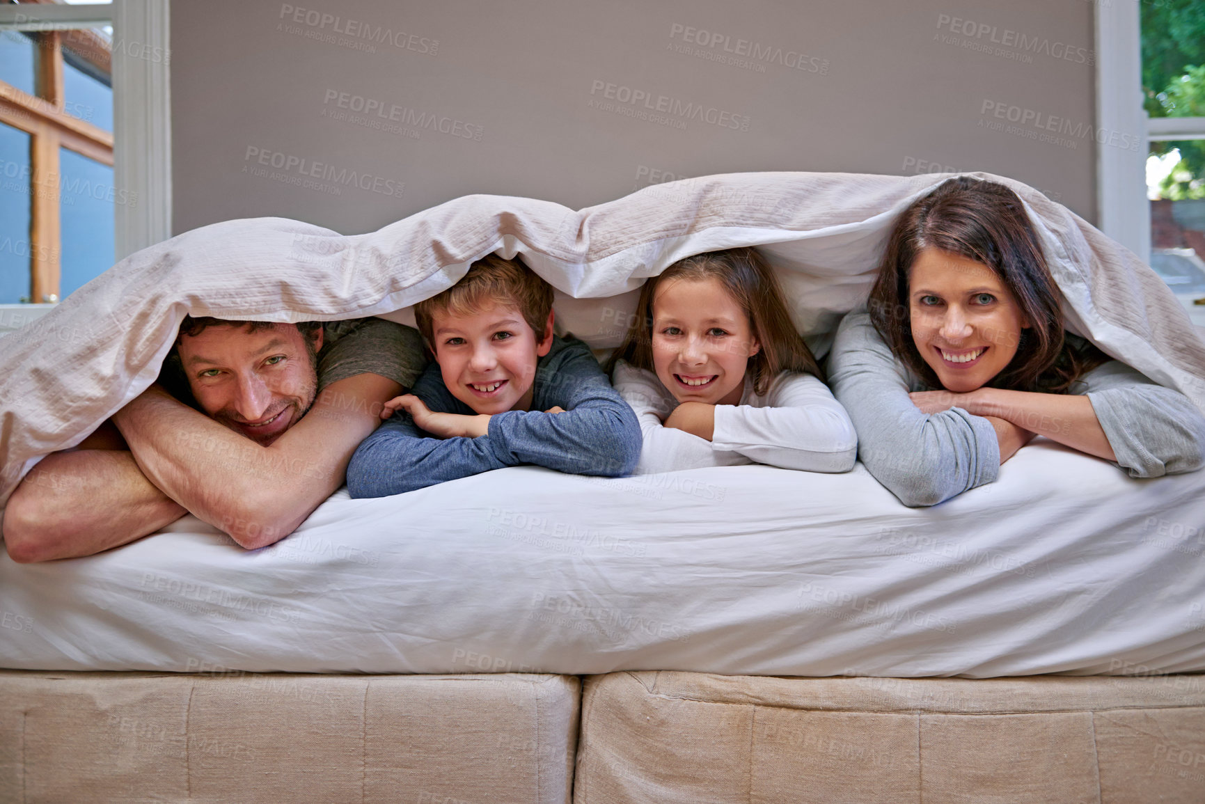 Buy stock photo Portrait, blanket and parents with children, bedroom and happiness with vacation and bonding together. Face, family and home with mother or father with siblings and relax with kids, smile or morning