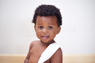 Buy stock photo Portrait of a cute baby boy playing with toilet paper at home