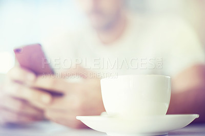Buy stock photo Man, hands and tea cup with phone at cafe for communication, morning or social media. Closeup of male person with drink or beverage on mobile smartphone for online chatting or texting at coffee shop