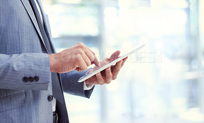 Buy stock photo Businessman, tablet and hands typing for research, analysis or networking at corporate or modern office. Closeup of man or employee working with technology for online search or browsing at workplace