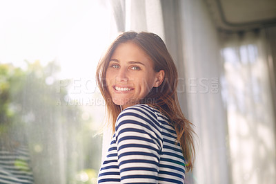 Buy stock photo Woman, smile and portrait in house for relax and calm for holiday and cheerful on blurred background. Young person and happy with window for view of garden or backyard with sunlight in lounge    