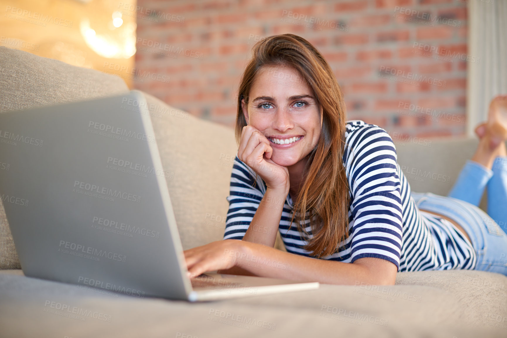 Buy stock photo Woman, laptop and portrait for social media, website and technology for relax in house. Young person, blogger or freelancer on sofa and smile with tech for email, internet and app for online post