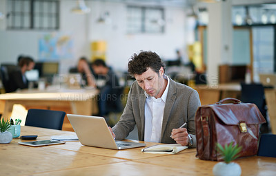 Buy stock photo Laptop, employee and man writing on notebook for sales in startup, business and corporate company. Workplace, bookkeeper and male person working with technology, online and internet in office