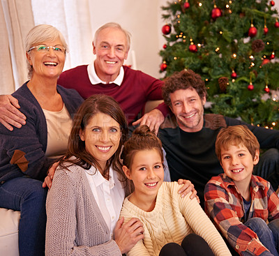 Buy stock photo Christmas, happy and portrait of family on sofa for festive, celebration and holiday cheer. Support, relax and smile with people in living room at home for gift giving, xmas and gratitude together