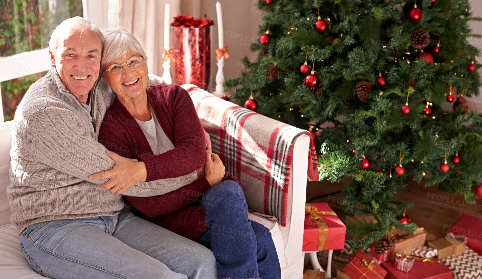 Buy stock photo Christmas, senior couple and couch for happiness, festive season or relax together at home. Xmas, love and elderly woman with mature man, smile or bonding for love, content and on sofa in living room