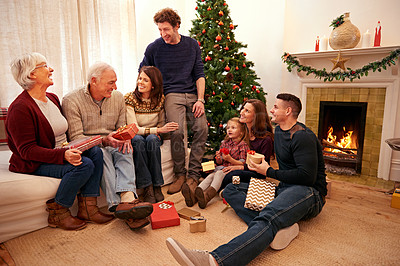 Buy stock photo Family, Christmas and giving gift and holiday celebration, generations with tradition and together in living room. Happy family, celebrate festive season at home and Christmas tree and decoration.