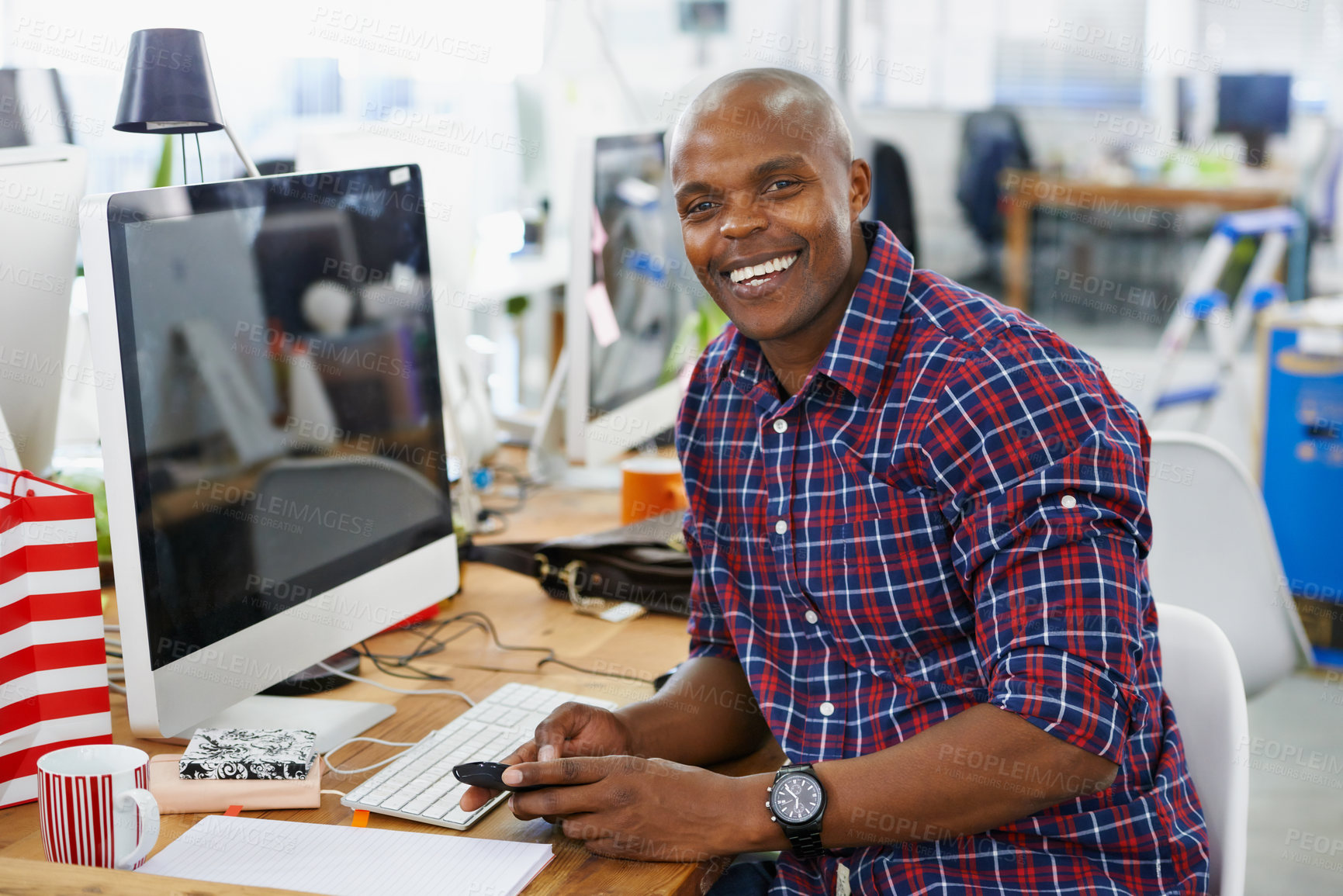 Buy stock photo African man, portrait and phone or happy with creative job, technology with web designer in office workspace at desk. Businessman, smile and workplace for online search with internet browse