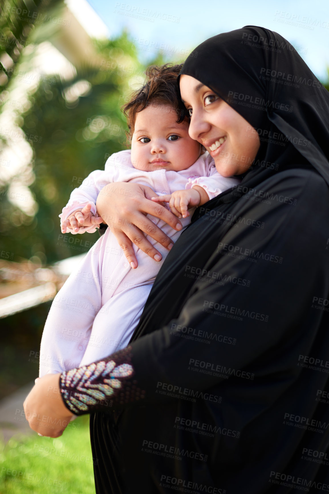 Buy stock photo Muslim, woman and baby happy outdoor, hug in garden with mother and child for Eid celebration. Motherhood, family life and Islamic holiday with hijab, infant and smile in backyard for bonding