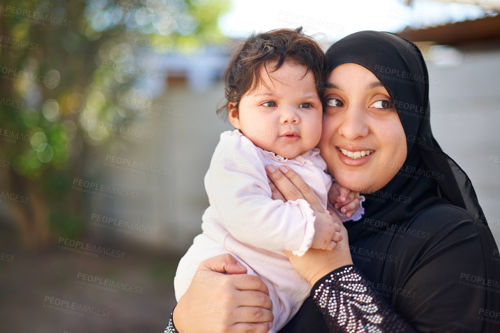 Buy stock photo Muslim, woman and baby hug outdoor, happy in garden with mother and child for Eid celebration. Motherhood, family life and Islamic holiday with hijab, infant and smile in backyard for bonding