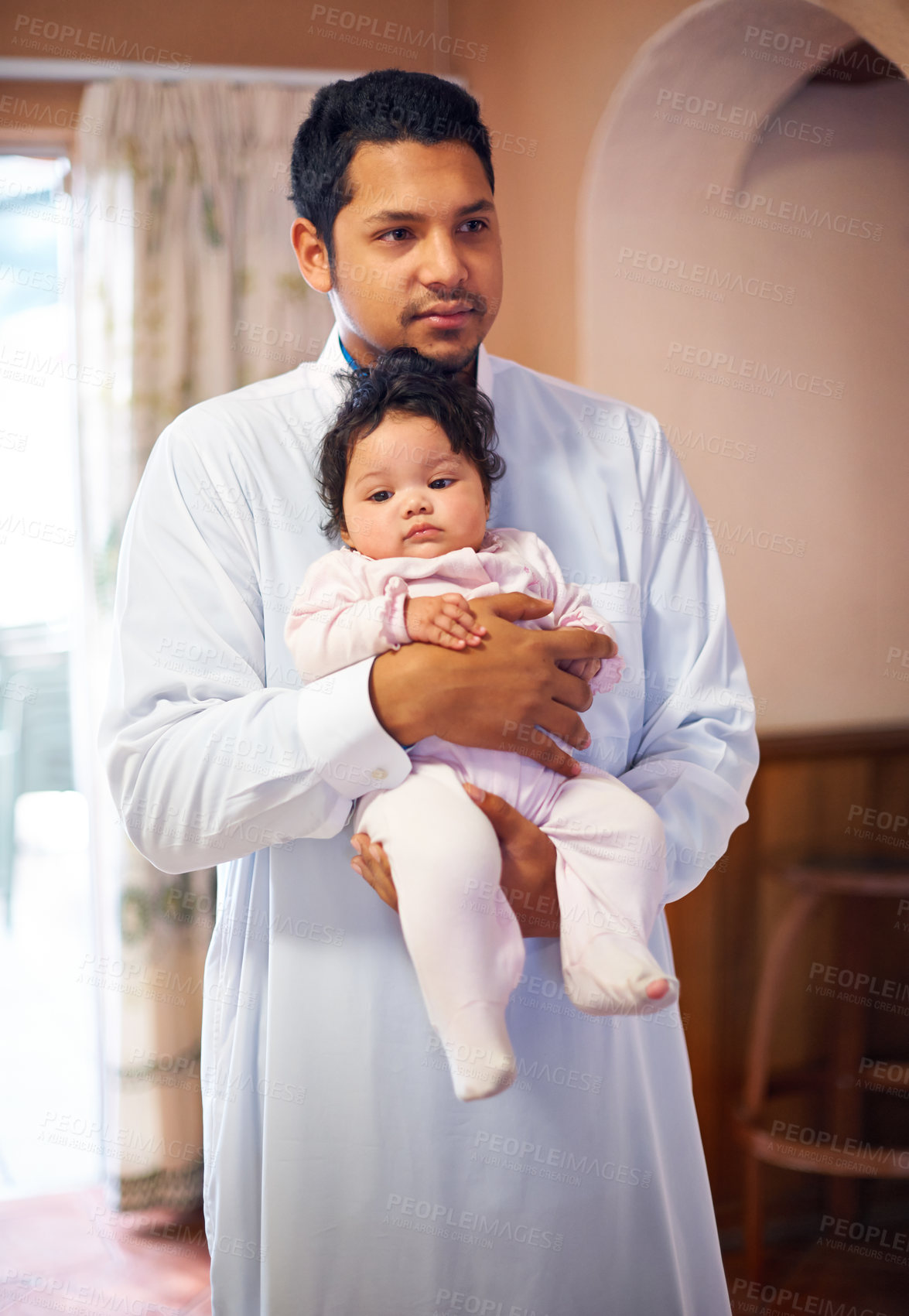 Buy stock photo Muslim, man and baby at family home with hug for bonding, love and care, growth and development for parenting. Cradle, cuddle and comfort with security, father and infant in Islamic house with life