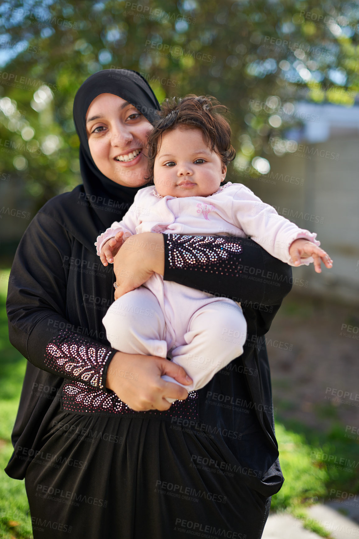 Buy stock photo Muslim, woman and baby in portrait outdoor, happy in garden with mother and child for Eid celebration. Motherhood, family life and Islamic holiday with hijab, infant and smile in backyard for bonding
