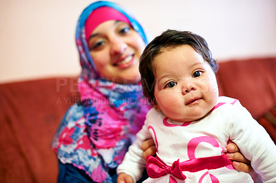 Buy stock photo Happy, baby and portrait of muslim mom in home with love and care for family in Saudi Arabia. Infant, child and Arabic mother relax on sofa with support and kindness for kid in embrace of mama