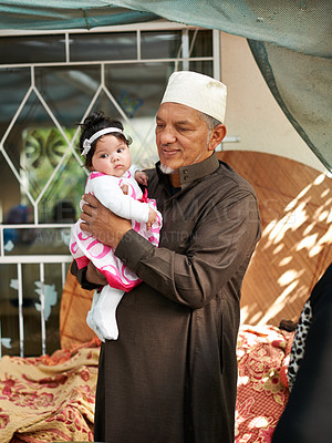 Buy stock photo Muslim, family and grandfather with baby for bonding, Eid celebration or Ramadan with old man and little girl at home. Love, care and support with people from Malaysia for event and Islamic holiday