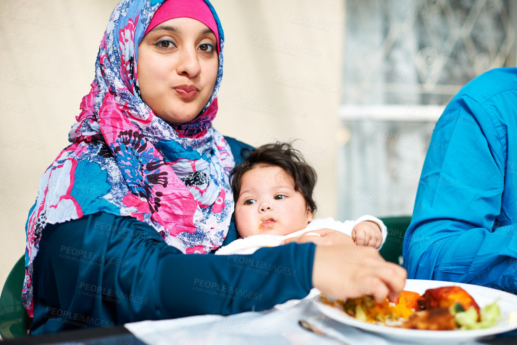 Buy stock photo Mom, baby and muslim in table for dinner with food for eid, ramadan and religion to enjoy at home. Faith, Islam and happy with meal or supper from fasting on religious outfit with feast and family. 