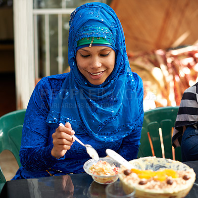 Buy stock photo Woman, muslim and table with dessert for ramadan or eid for religious holiday, celebration and happiness. Islam, traditional and female person with hijab for festival, culture and food for fasting