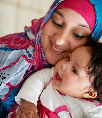 Buy stock photo Happy, muslim and mom with baby in home with love and care for family in Saudi Arabia. Infant, child and Arabic mother relax in house with support and kindness for kid in embrace or hug with mama